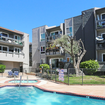 View of the pool and surrounding apartment buildings at Midtown Apartment Homes