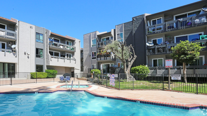 View of the pool and surrounding apartment buildings at Midtown Apartment Homes